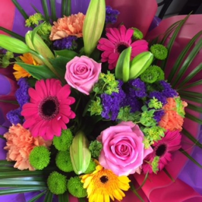 Vibrant Handtie - An elegant mix of pinks purples and greens would make this the ideal gift for any occasion