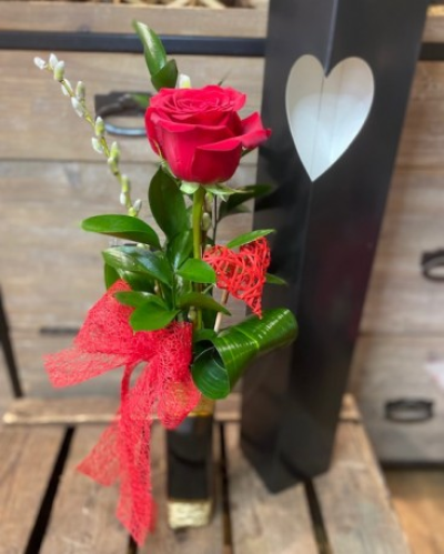 You're The One - Single Rose Vase.

Stunning single red Freedom rose presented in a single stem black and gold ceramic vase displayed with a folded aspadistra leaf and ruscus. Beautifully presented in a stylish black and white gift bag. 

Hand delivered by your local florist Susettes Flowers to help guarantee success on Valentine's day!Delivery available in Bury St Edmunds and surrounding villages. 

 

Please note that due to the seasonal availability of flowers it may be necessary to vary individual stems from those shown. Our skilled florists may substitute flowers for one similar in style, quality and value. Where our designs include a sundry item like a vase or basket it may not always be possible to include the exact item as displayed. If such an occasion arises we will make every effort to replace the item with a suitable alternative.