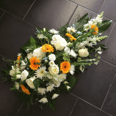 Lemon Single Ended Spray - An elegant creamy white single ended spray. Yellow Gerbera, cream spray Carnations, Hypericums and white Viburnums are lovingly intertwined with variegated Dracaena, Foxtail Ferns, Cocculus and variegated Ivy.