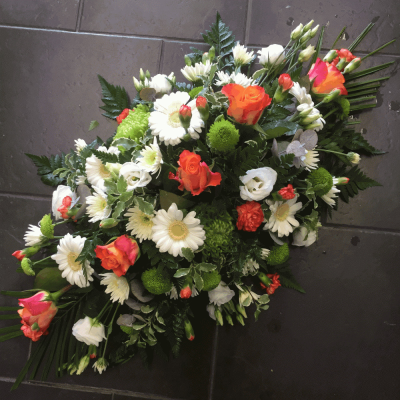 Orange & White Double Ended Spray - Orange & White Double Ended Spray
A beautiful vibrant orange and white double ended spray. Vibrant Orange Roses, stpray carnations, gerbra and Lime Shamrock blooms sit perfectly alongside variegated lime Dracaena, Aralia leaves, Cocculus, Salal and Eustomia.

Hand delivered by your local florist in Bury St Emunds by Susettes Flowers

Image shown is Medium.2.5ft

Also available in Standard 2ft & Large Sizes 3ft.