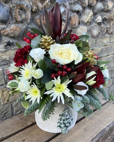 Yuletide arrangement - This beautiful arrangement is a perfect gift for the season, with festive scented foliages, and rich colour tones presented in a classic Christmas pot.