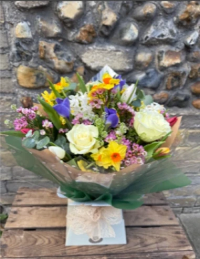 Springtime Handtied - This joyful handtied bouquet is the perfect gift for the season, with a gorgeous assortment of scented springtime flowers hand delivered by your local florist Susettes flowers . 

Please note colours and flowers may vary from photo due to availability.